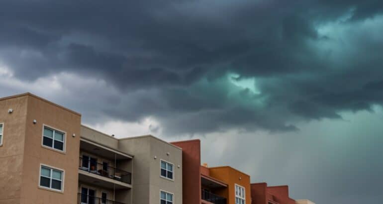 Storm clouds over a Florida condominium building after a skipped condo insurance appraisal left the association underinsured